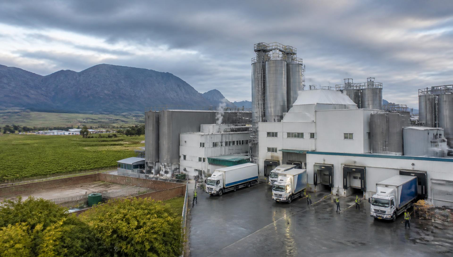 South African manufacturing plant beside farmland